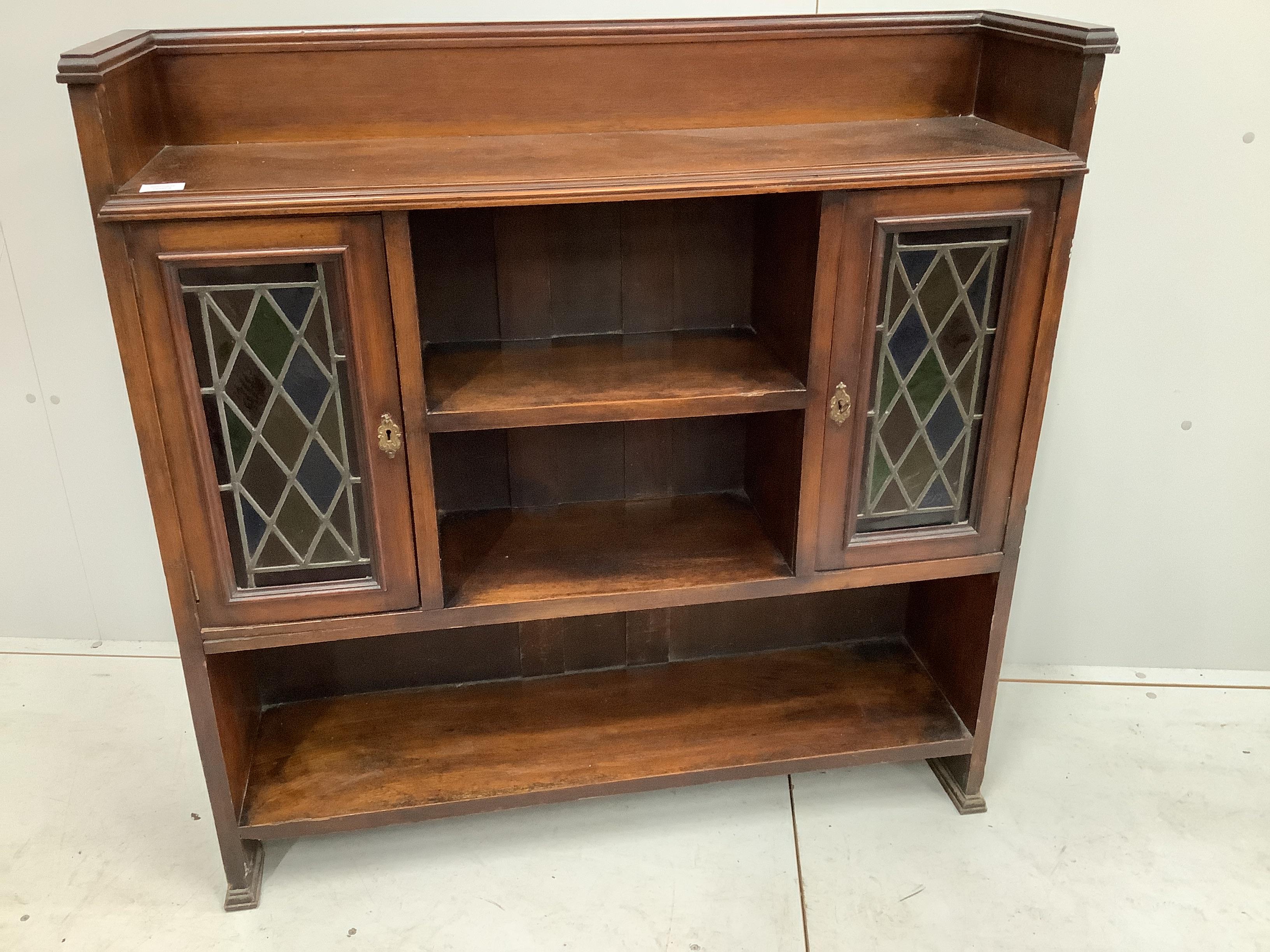 An early 20th century oak bookcase, width 106cm, depth 28cm, height 107cm